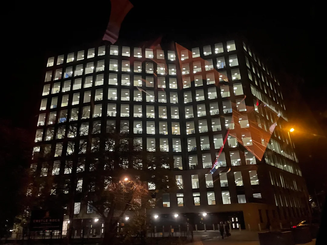 Empty office building at night with all its lights on